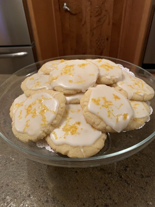 Finished lemon cookies on glass tray