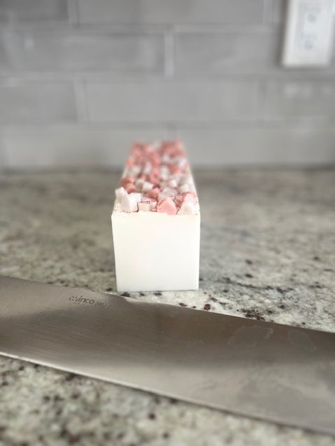 Thumbnail: Full loaf of Sweetheart Valentine’s soap with lavender and rose, shown with cutting knife