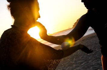 Two people dancing on sunset