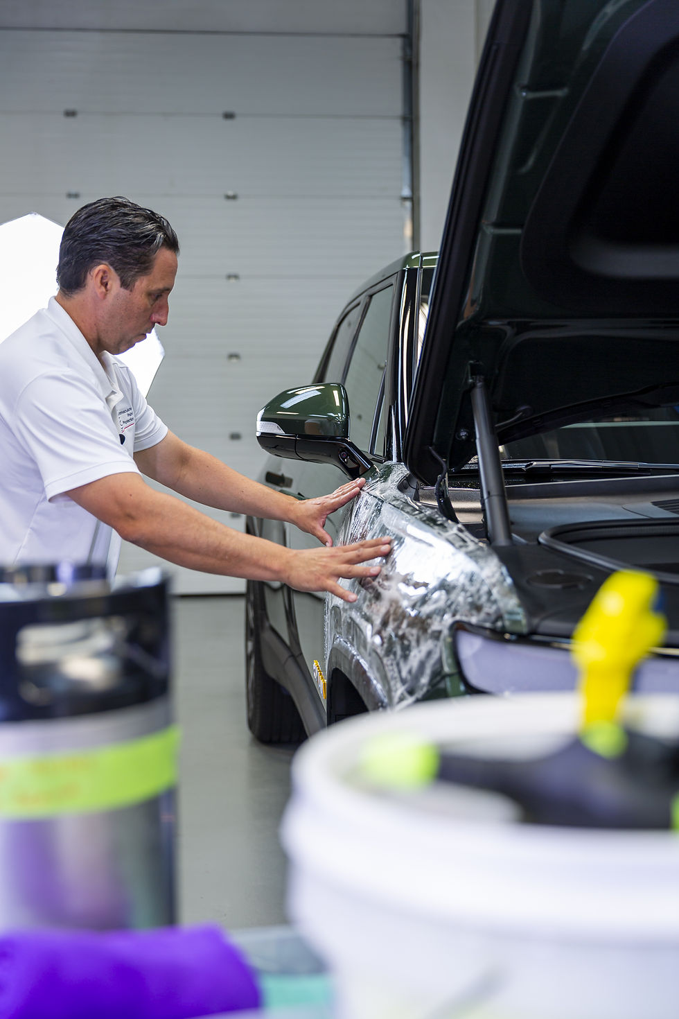 SunTek Reaction paint protection film also know as clear vinyl wrap is being applied to stop paint chips on a Rivan R1T.