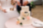 Gorgeous bride and stylish groom cutting