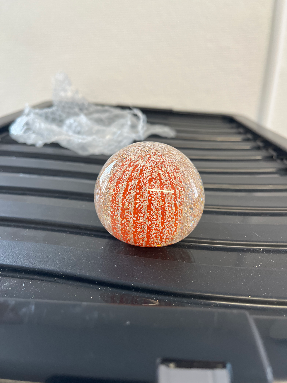 Orange paper weight