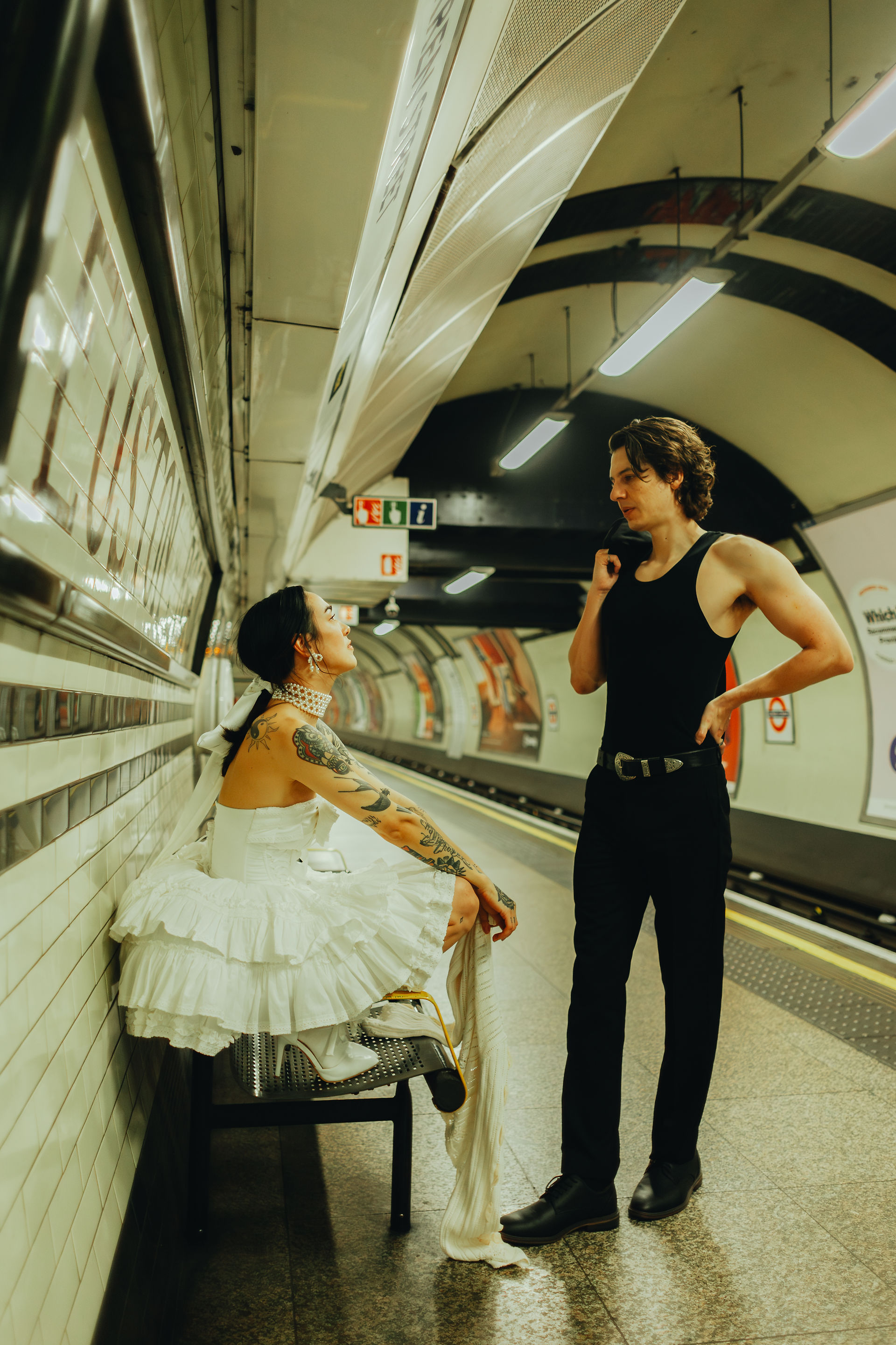 pre wedding couple waiting on platform