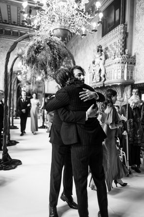 groom hugging best man at Carlton Towers during ceremony