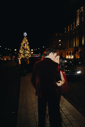 bride and groom share a kiss in the middle of the road 116 Pall Mall