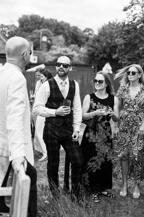 candid of wedding guests in the pub 