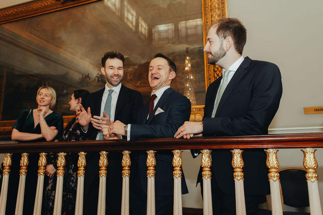 guests having a laugh before the ceremony