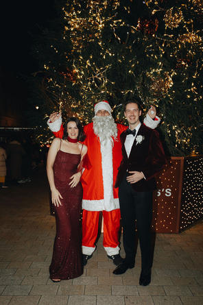 bride and room pose with Santa 116 Pall Mall