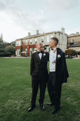 Couple hugging and looking into each others eyes at Bowcliffe Hall in Leeds 