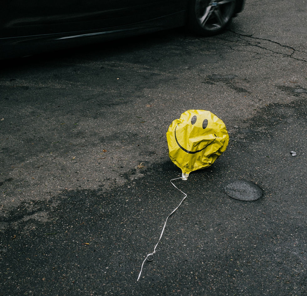 Deflating smiley face balloon - Nathan Dumlao