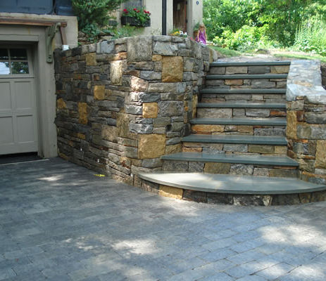 Rebuilt masonry wall and steps