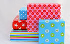 isolated-closeup-shot-gift-boxes-colorful-wrapping-stacked-top-each.jpg