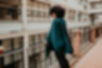 Thumbnail: Woman wearing sustainable turtleneck poncho in peacock colour, longer version - Lindsey M collections