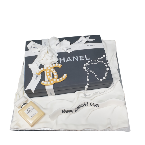 Bespoke Chanel box cake with black and white design and gold accents, crafted in Solihull, West Midlands.