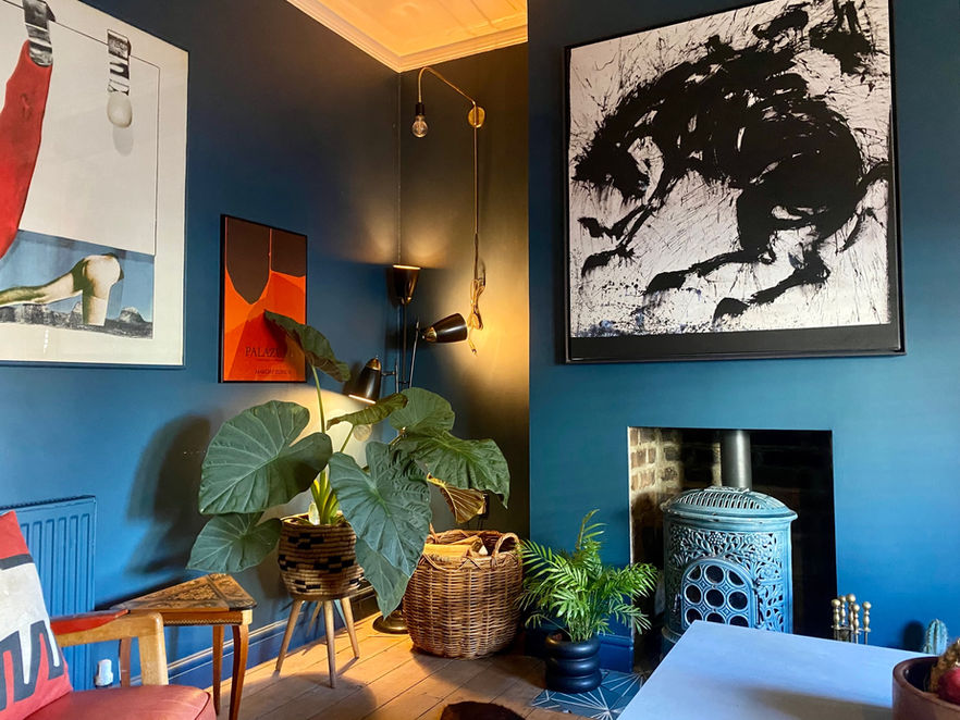 Vintage woodburner and artwork in Victorian home in East London