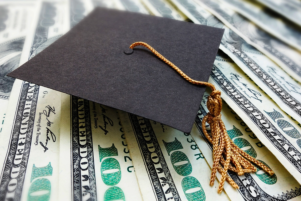 Graduation Cap Laying On Top of Several Hundred Dollar Bills.