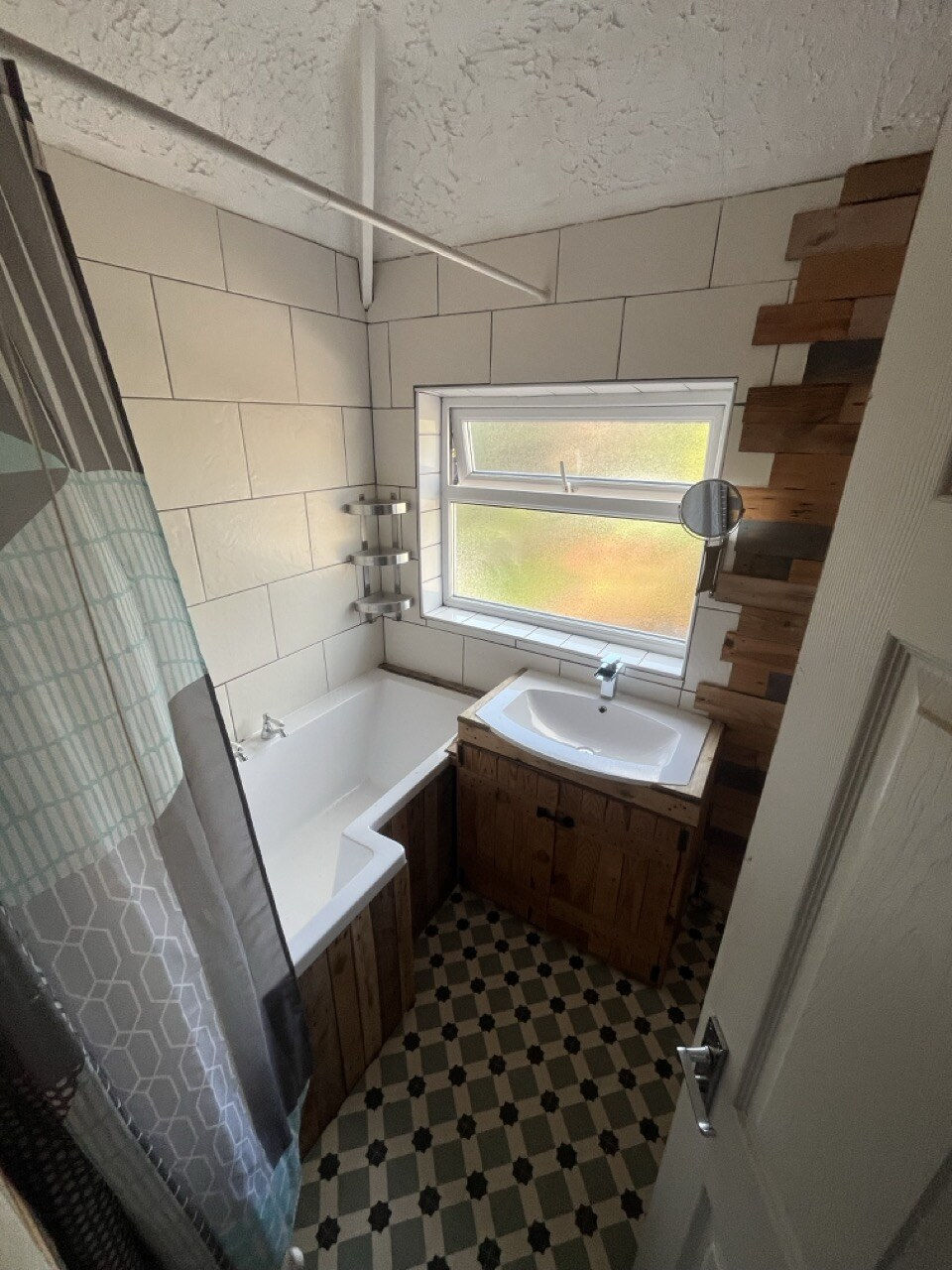 Before - original bathroom with dated tiling and fittings