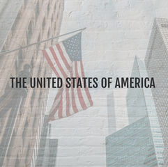 City in USA with an American flag hanging from a building