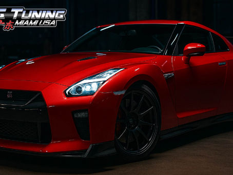 Red sports car with LED headlights in a tuning garage – IG Tuning Miami