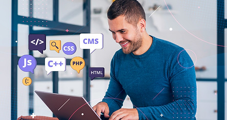 Developer using a laptop with coding language icons