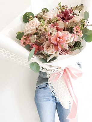 Large wrapped bouquet of beautiful pink and white blooms