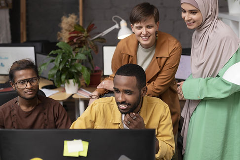 medium-shot-people-looking-computer (1).jpg