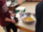 students chopping vegetables