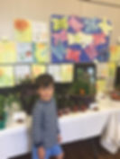 student with plant display