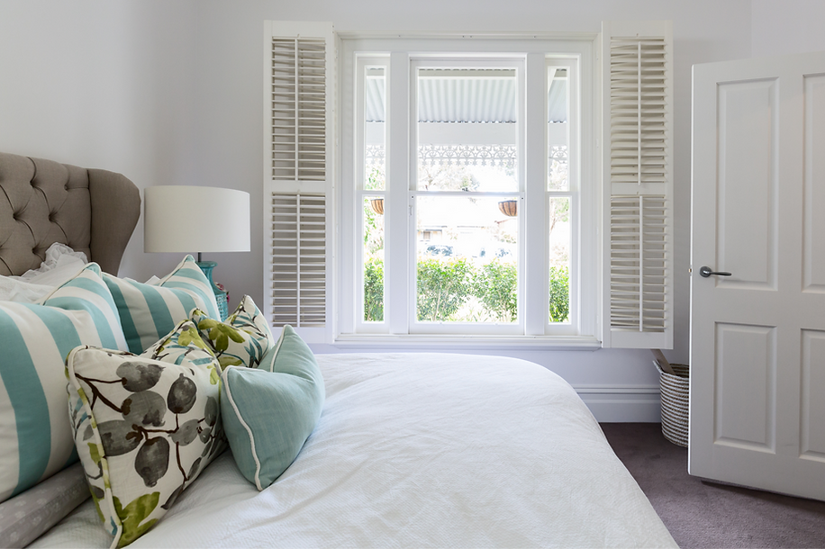 Bed with Blue Pillows_edited.png