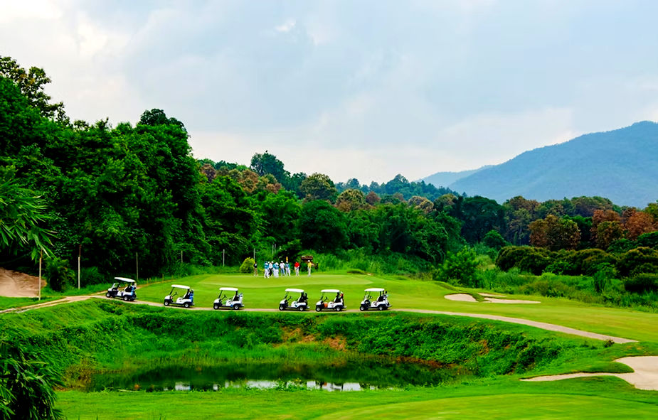 A golf course charity event with 6 golf carts traveling in line. DJ Golf carts provides transportation and logistic options for these types of events.