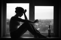 bigstock-Woman-In-Depressed-Mood-Sits-O-89032895.jpg