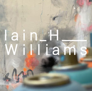 Iain H Williams - white letters on a blurred spray paint backdrop.