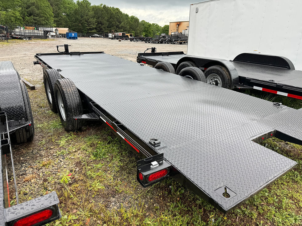 Thumbnail: Gratimax XL car hauler trailer with dual axles and a diamond plate steel deck, designed for heavy vehicle transport and rugged durability.