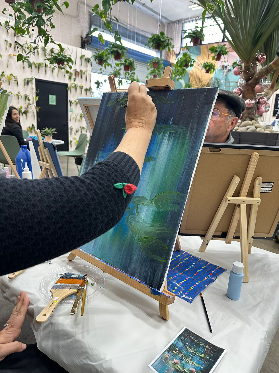 Painting setup outdoors by the pool at private art party in San Diego