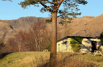 2 bedroom chalet at Inchree, with Ardgour mountains beyond. Taken February 2025.