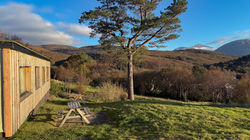 LAwn and patio area in front of Glen Gour & Glen Tarbet cabins