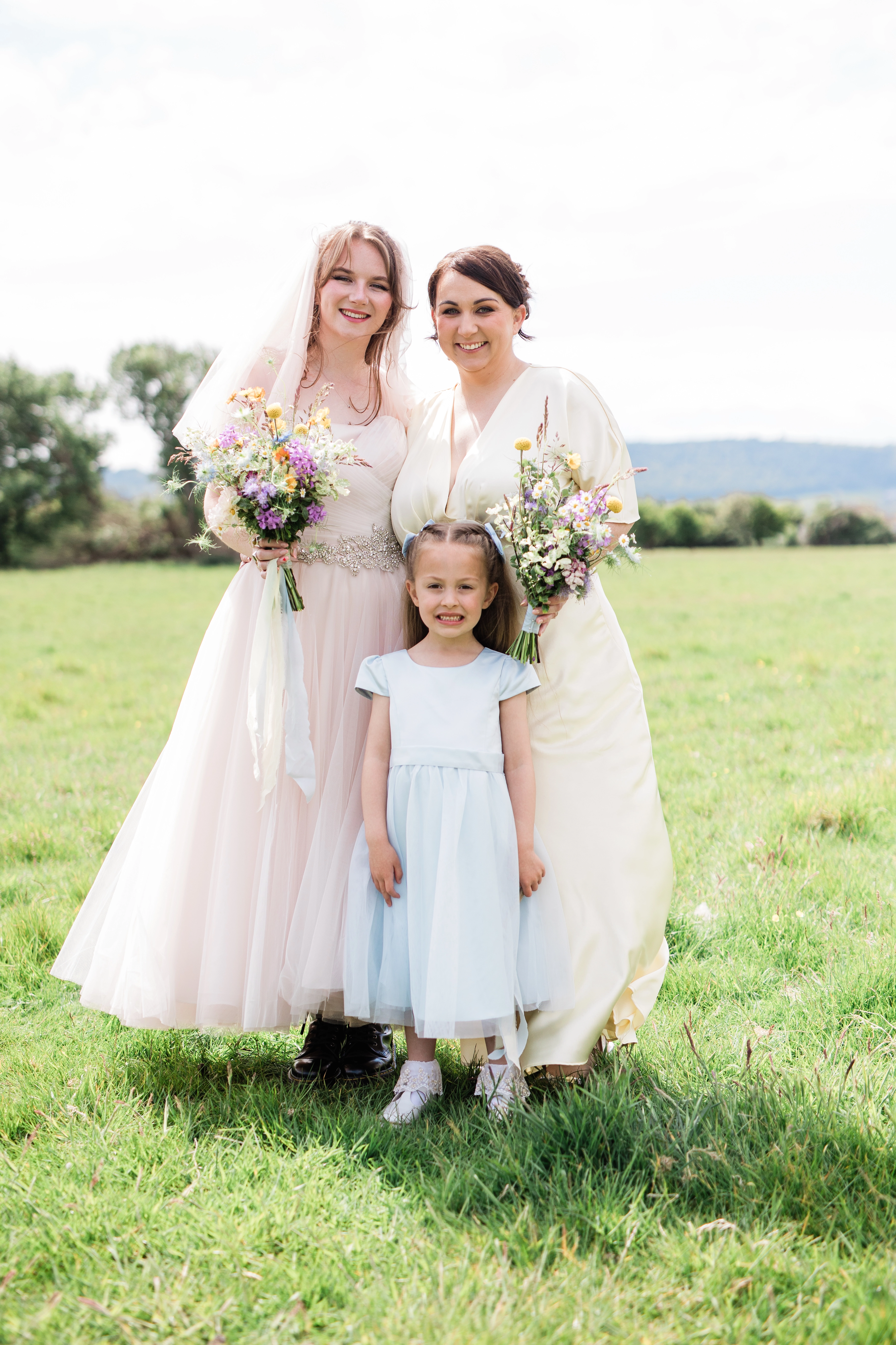 The bride, bridesmaid and flower girl
