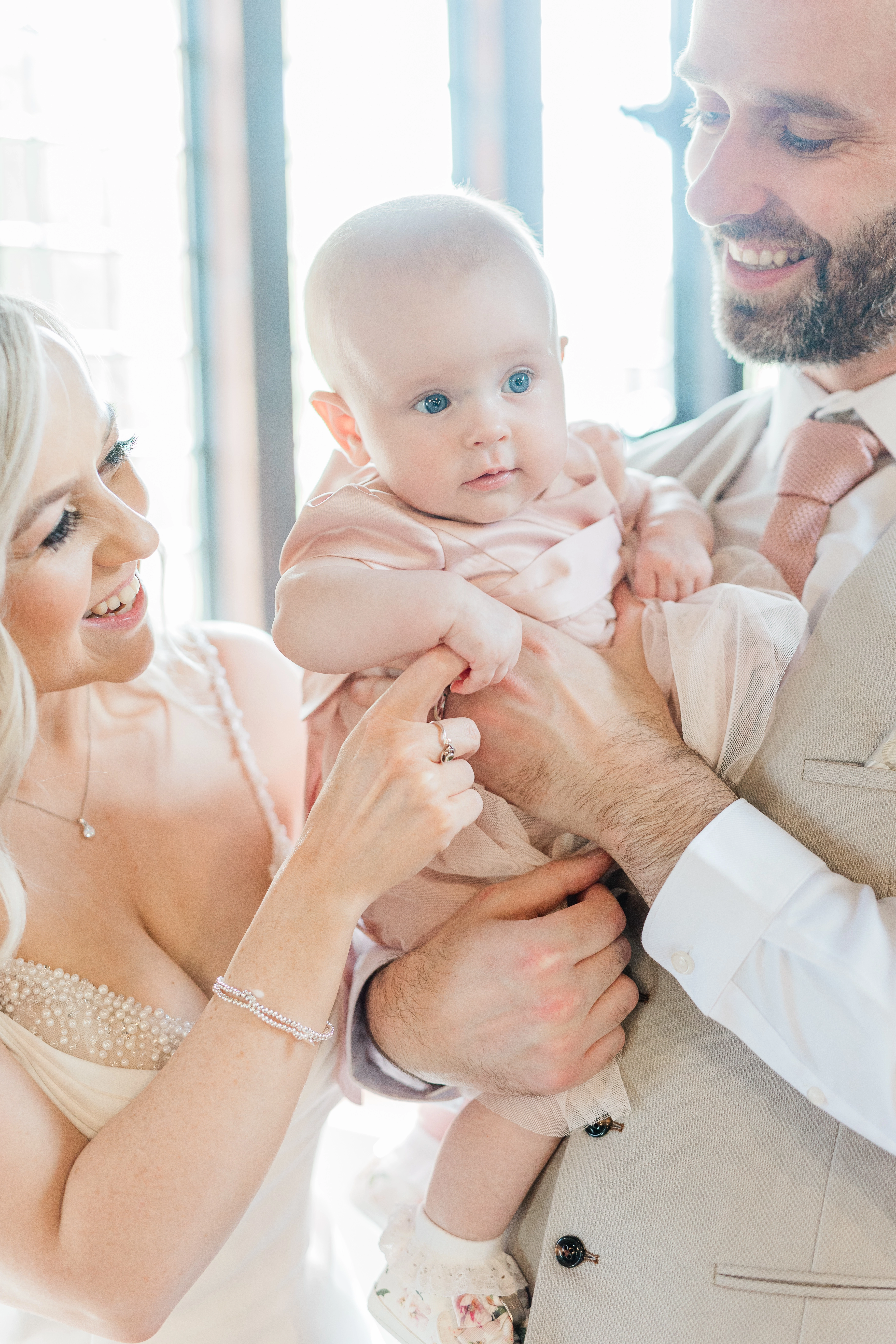 the bride and groom and their daughter