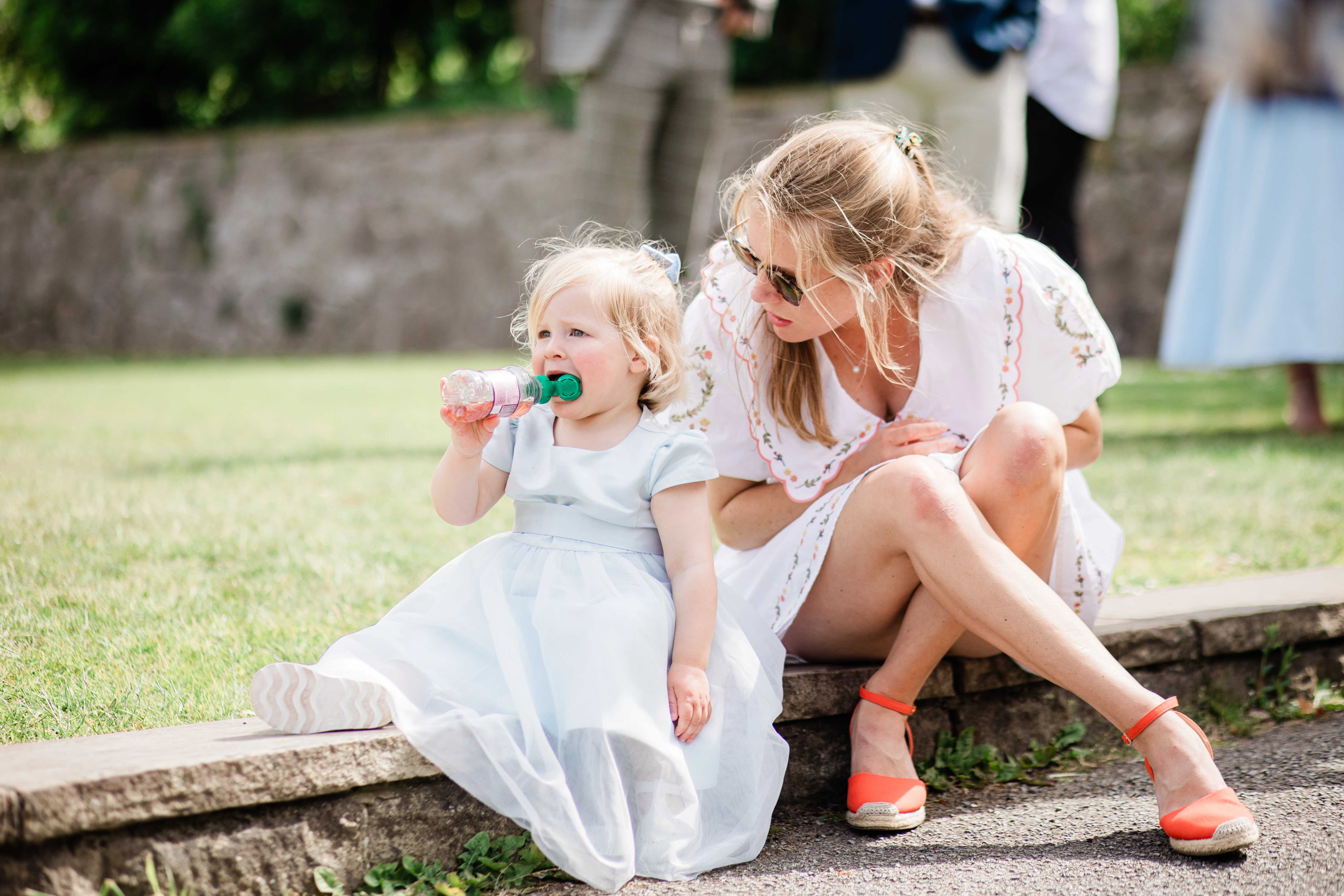 A Guest looking at a child at the wedding reception