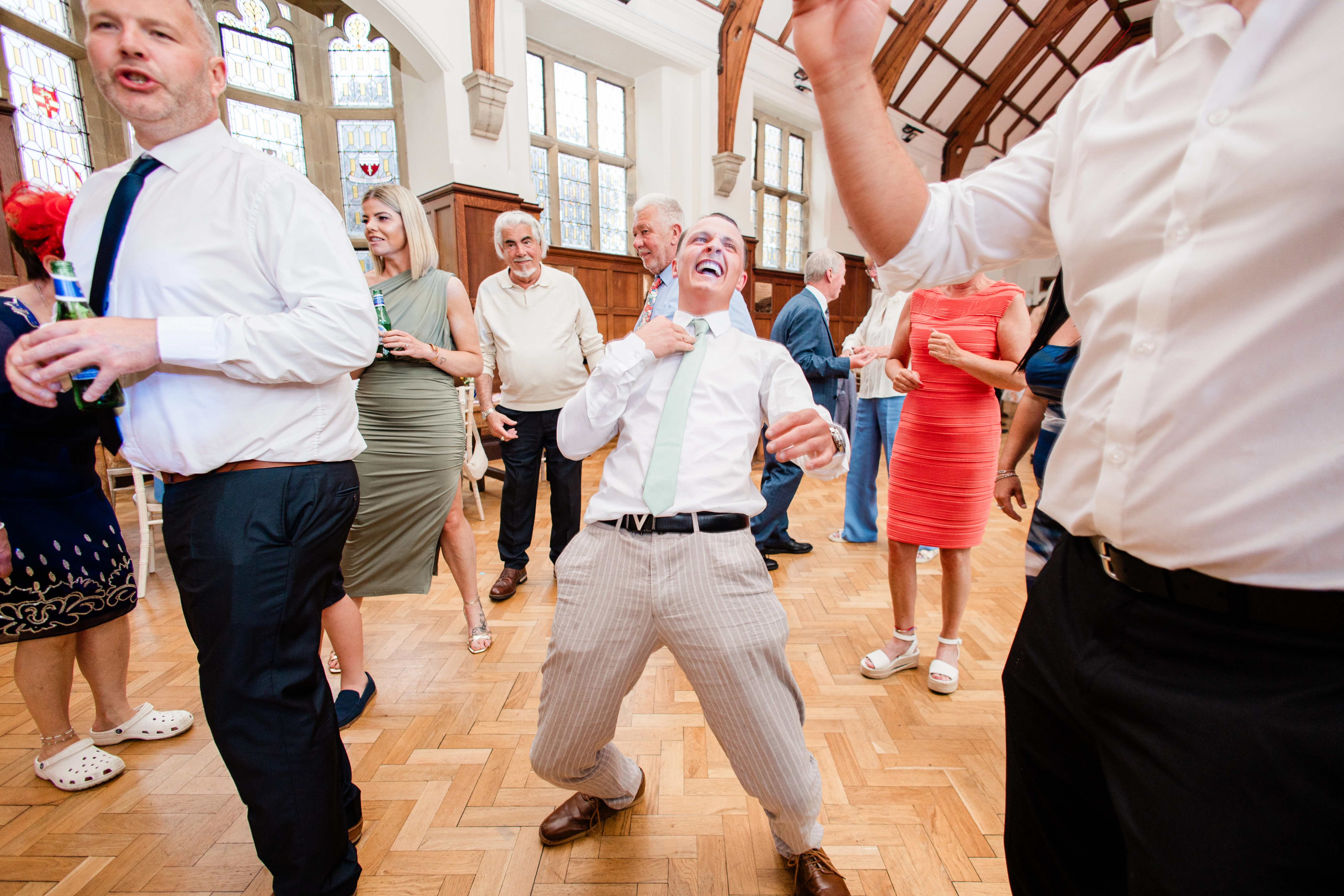a guest dancing on a busy dance floor