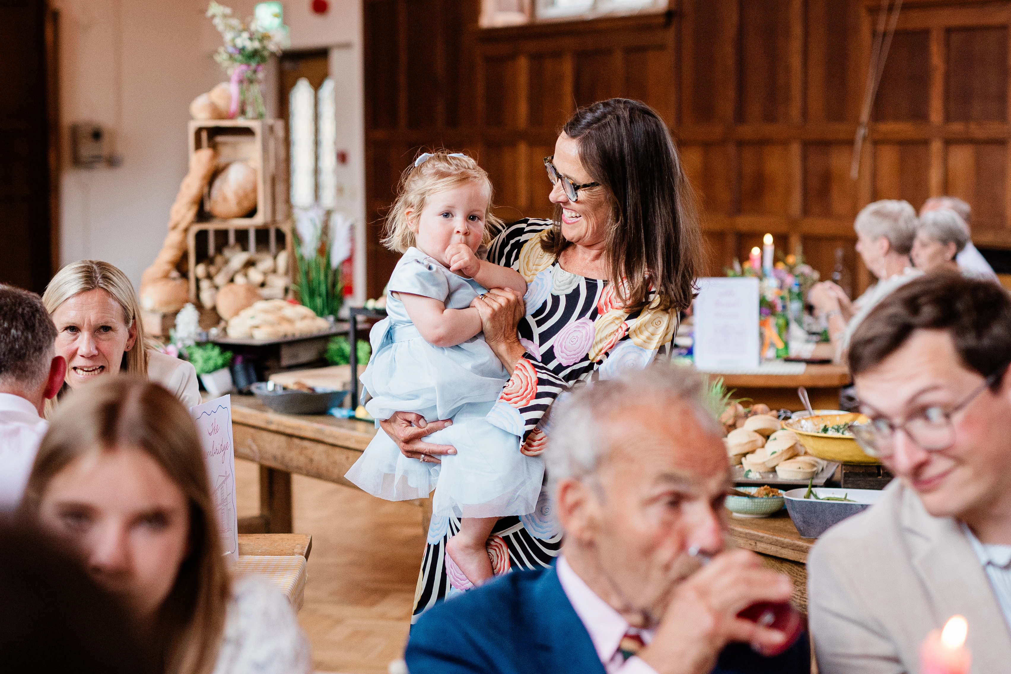 a guest holding her child