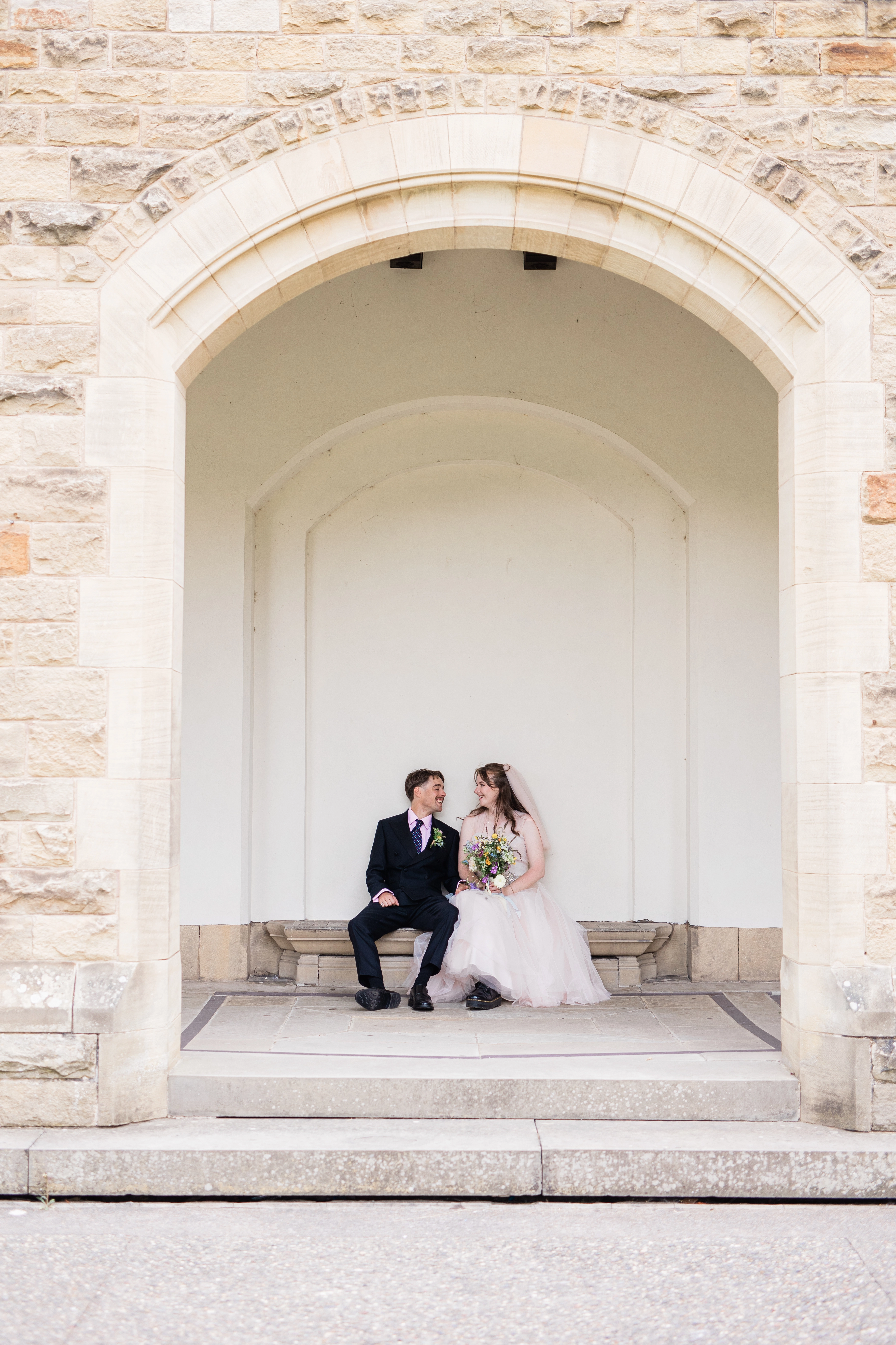 The bride and groom sharing a quiet moment together  away from their guests