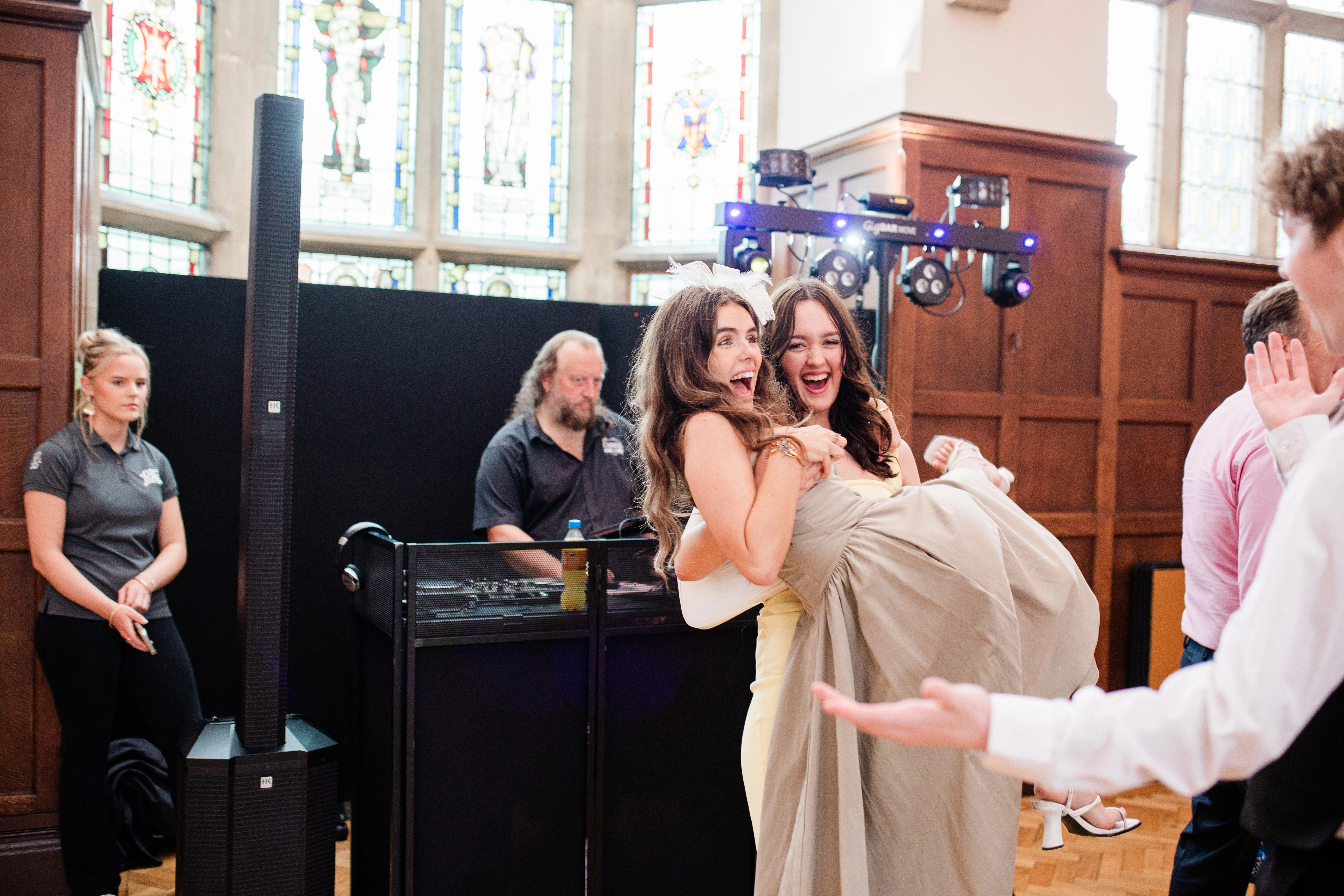 a guest carrying another guest on the dancefloor