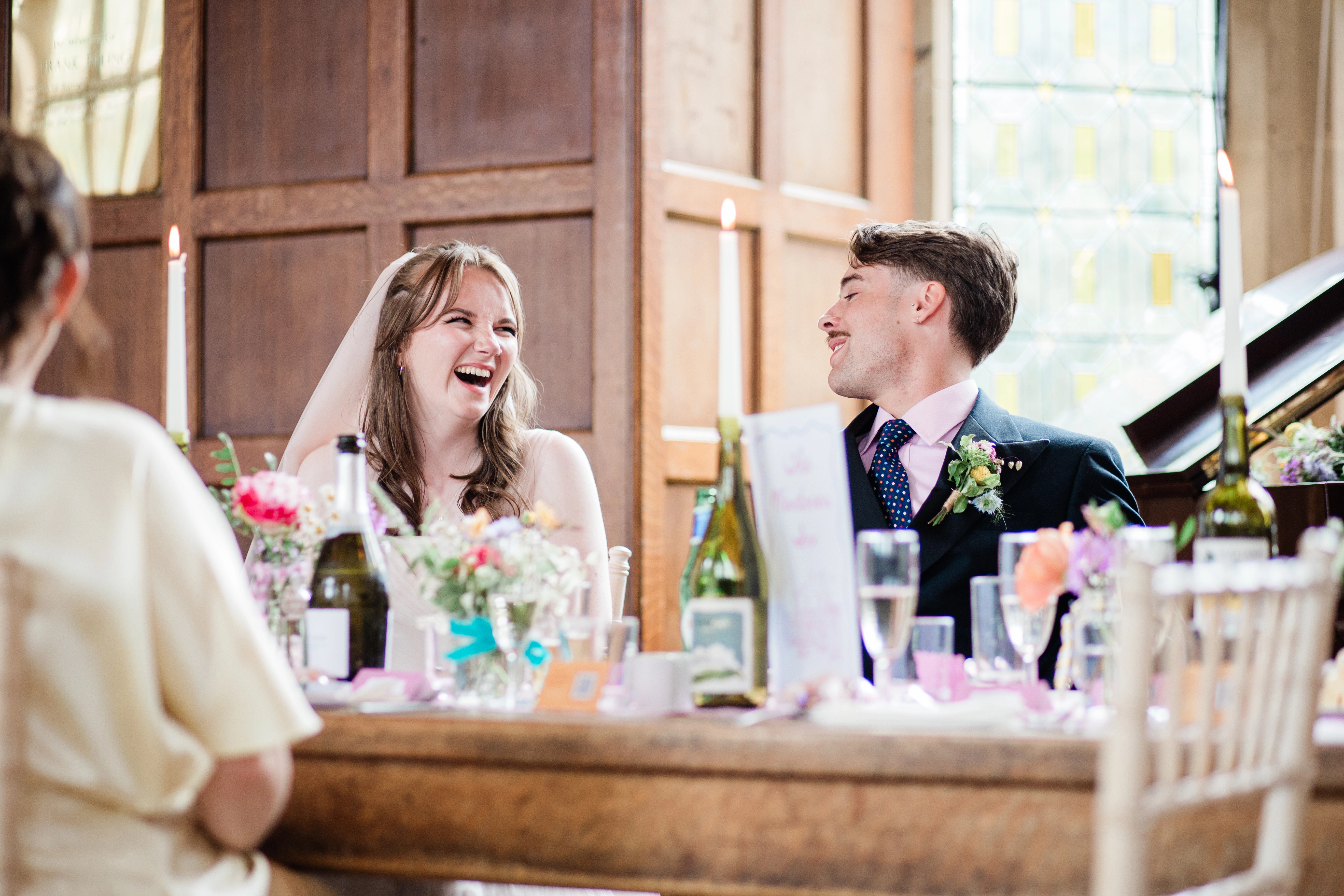 Bride and groom laughing together