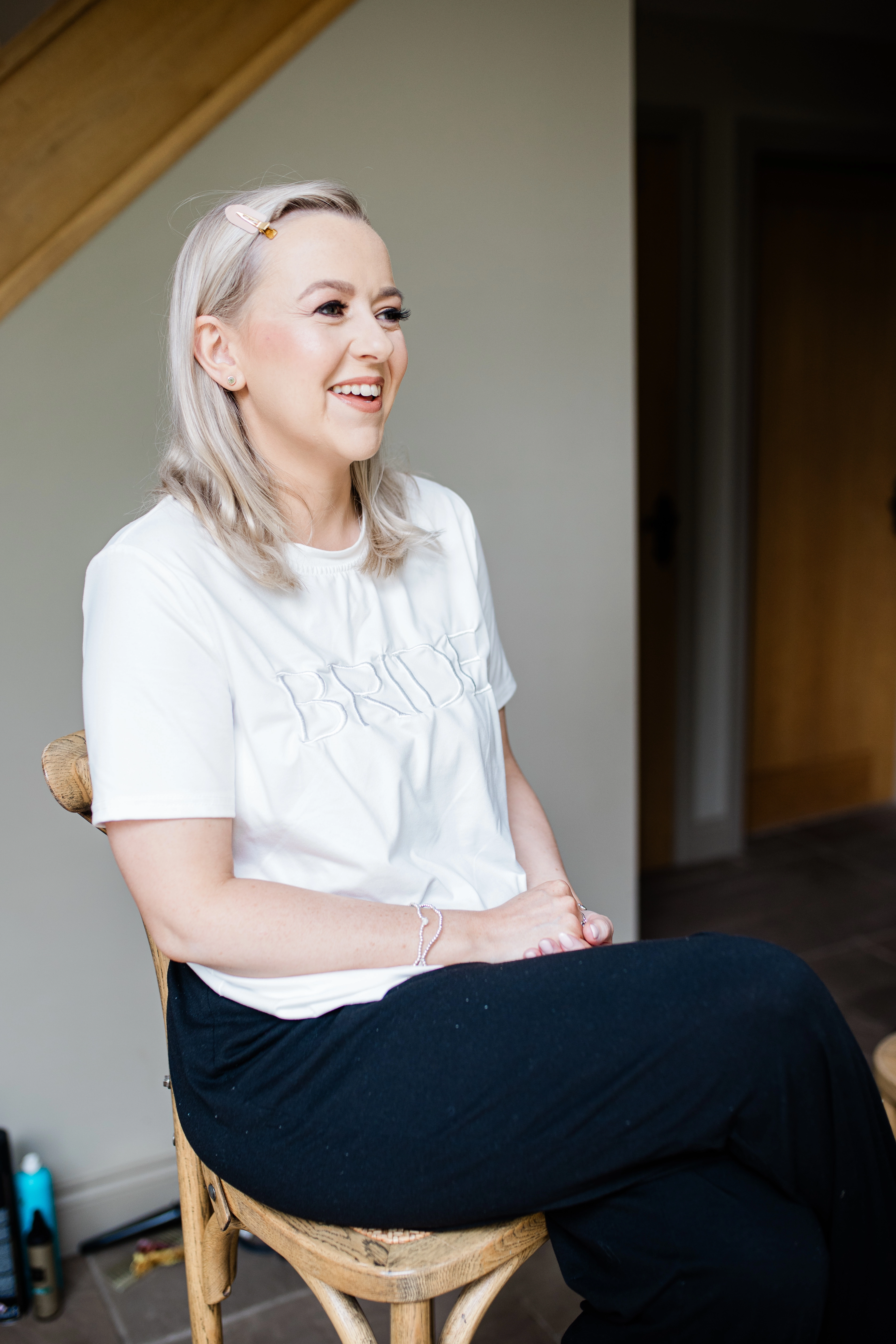 bride getting her makeup done prior to the wedding