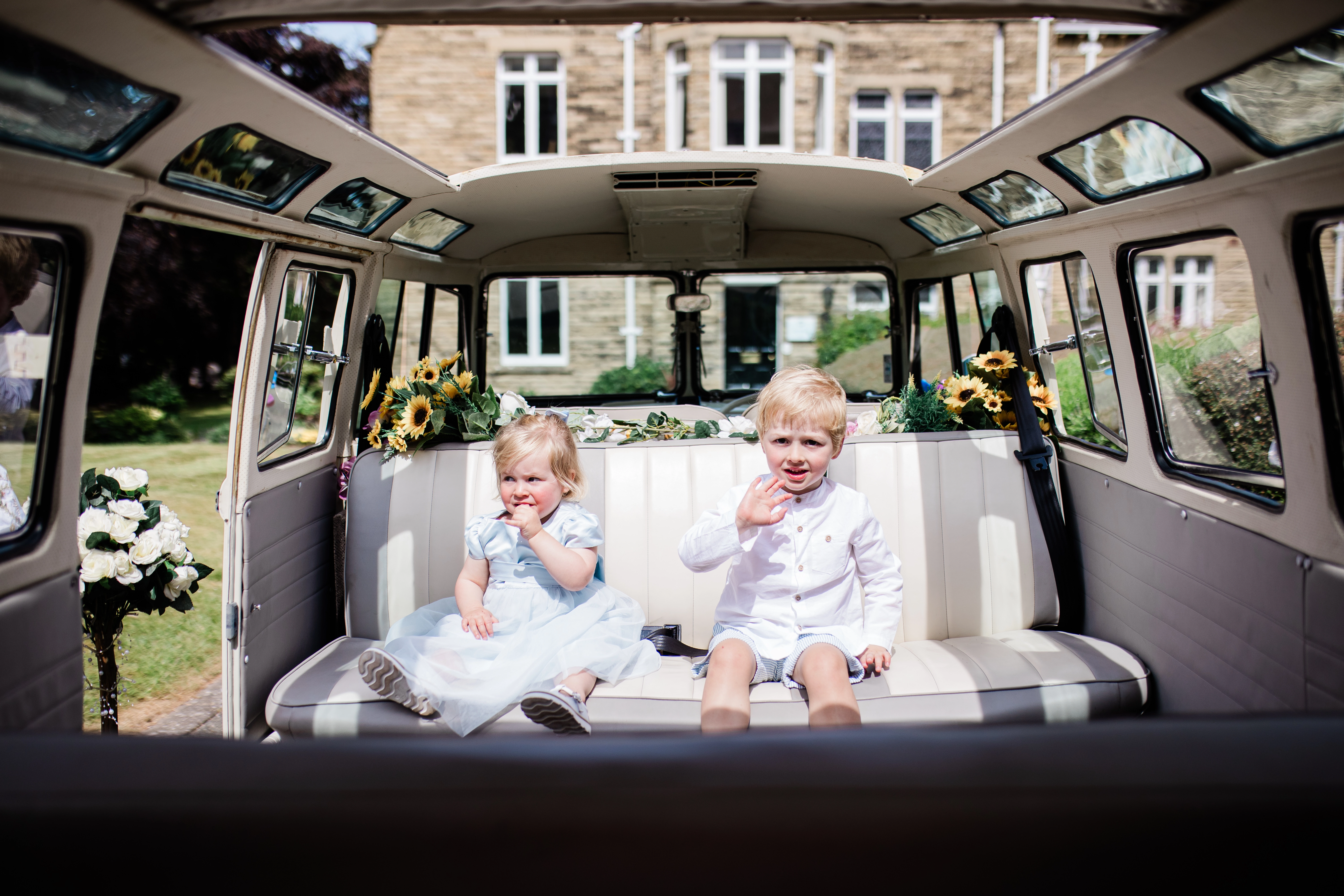 2 Kids sat in the VW Camper