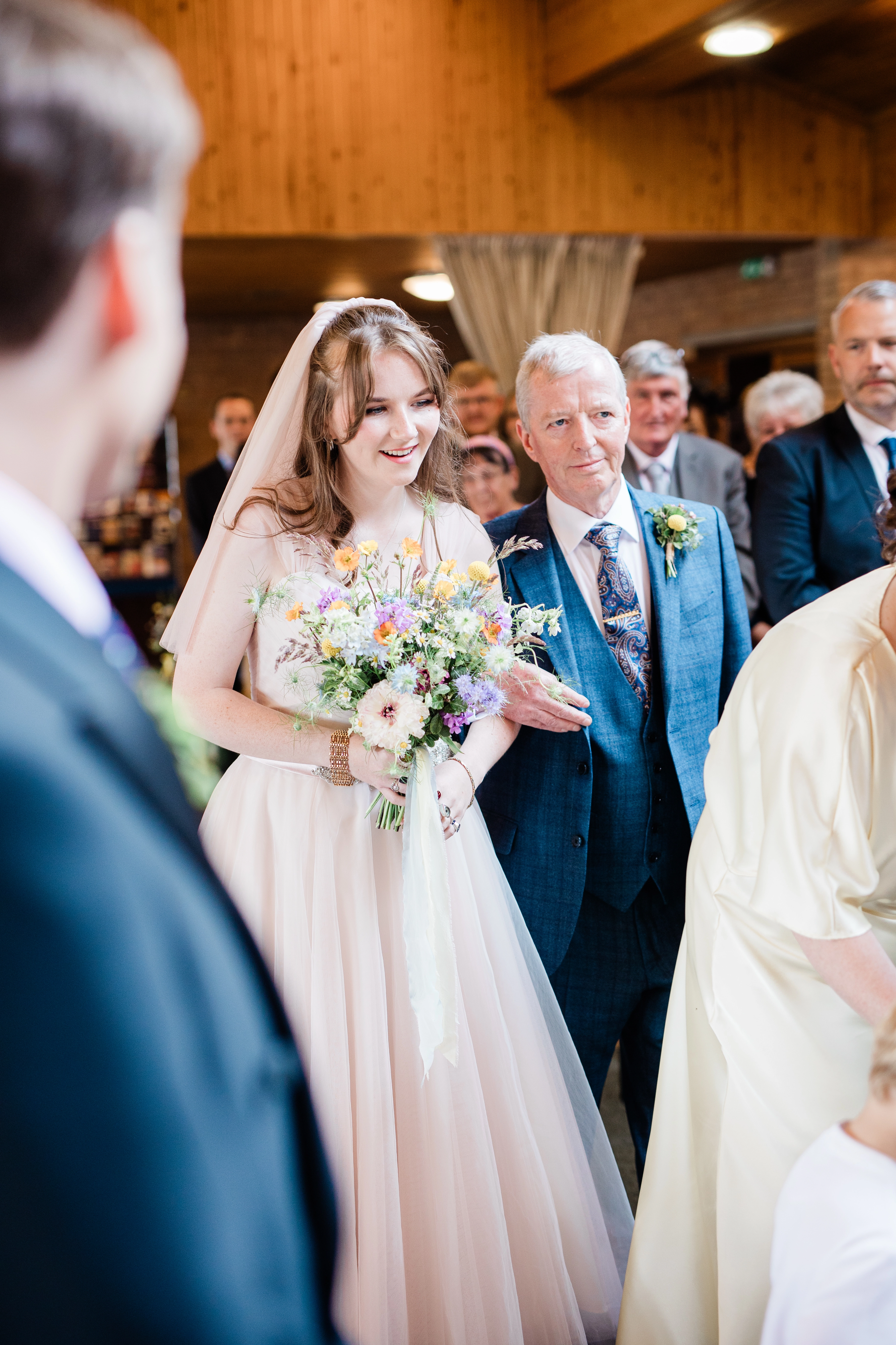 A Bride Walking down the aisle with her dad