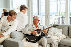 Father playing guitar before wedding in Grayton Beach, Florida 30A