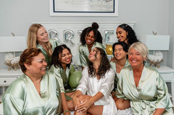 Port St. Joe wedding photographer bride and bridesmaids wearing matching pajamas while getting ready