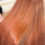 Thumbnail: Women with copper coloured hair that is very shiny and in very good condition
